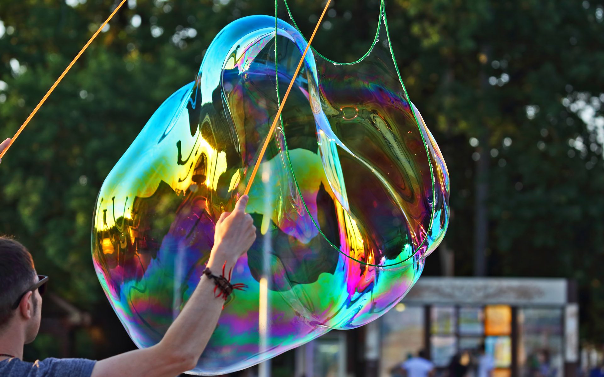 the man let a big bubble in the street